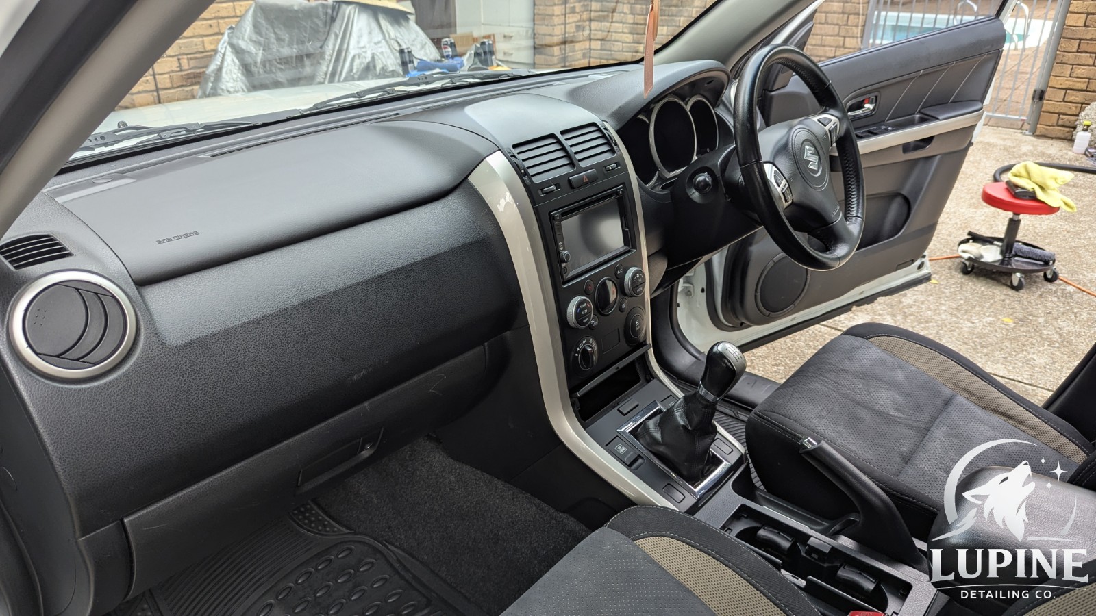 Suzuki Grand Vitara front left interior after detail